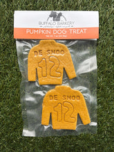 Load image into Gallery viewer, Pumpkin dog treat package with 'DE SNOO 12' design on grass